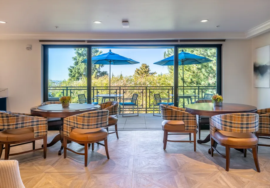 Open dining room with large windows.