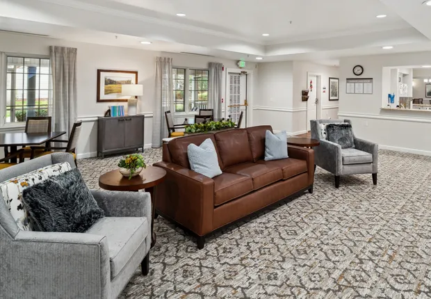 Senior Living in Lakewood featuring ample seating with plush couches.