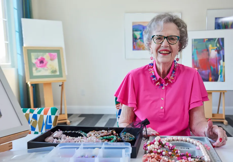 Senior woman making necklaces.
