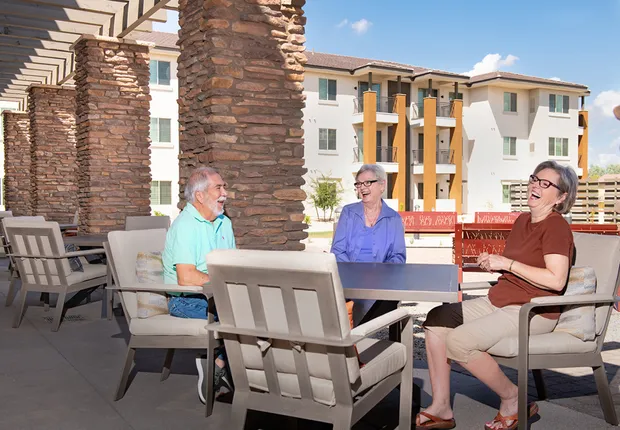 ACOYA Mesa seniors enjoy their patio outside their senior apartments