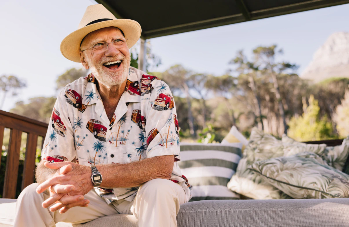 A happy senior smiling outside