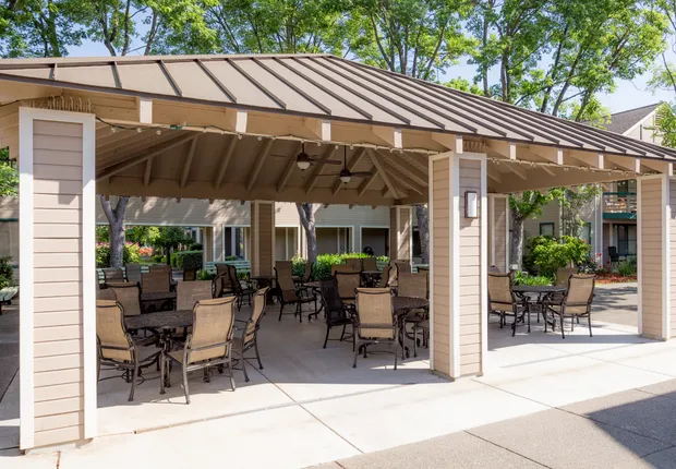 Senior Living in Vacaville featuring a pergola with comfy seating