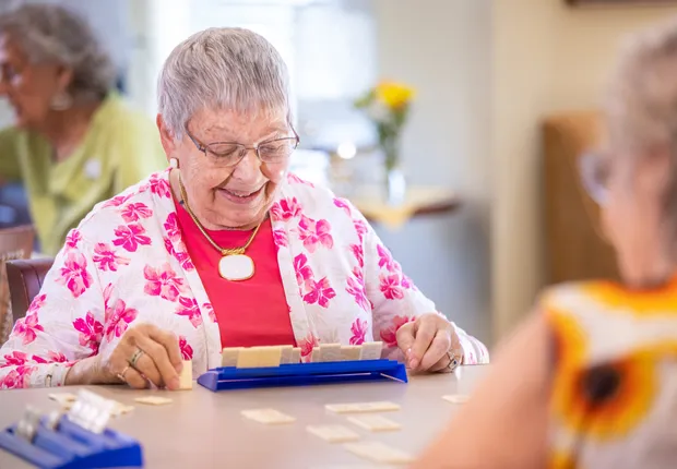 Senior woman plays Scrabble