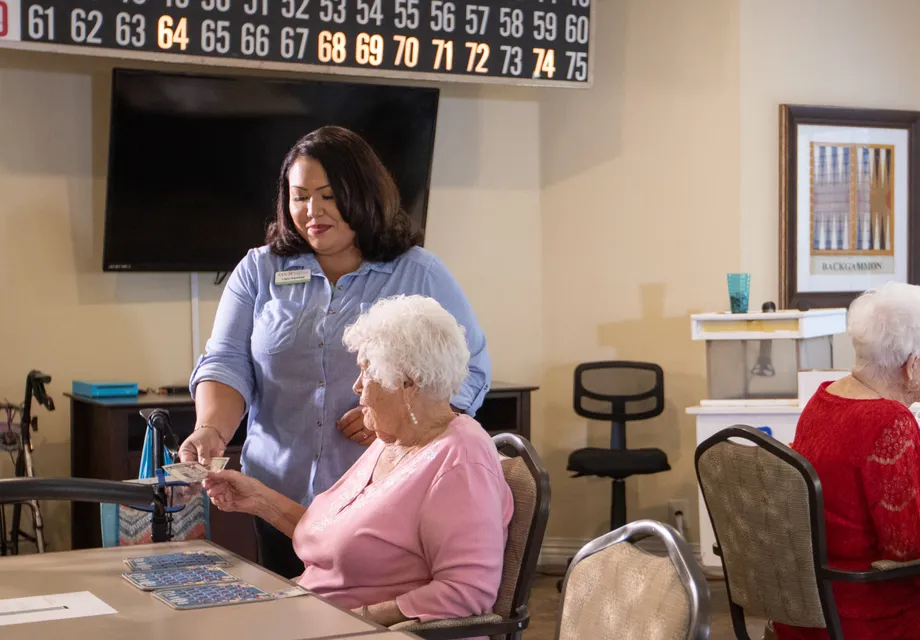 Senior care in Vacaville CA: caretakers and seniors putting together a puzzle