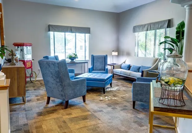 Dining area with blue chairs Senior Living in Turlock