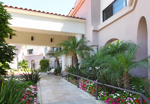 Senior Living in Culver City featuring tree-lined walking paths