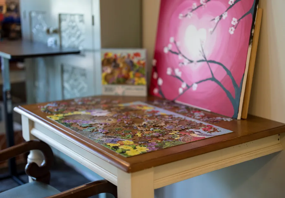 A game room with a puzzle table.