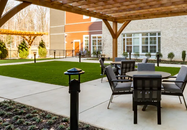 Senior Living in Germantown with seating under a pergola.
