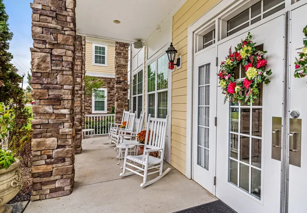 Senior living in Huntersville, covered patio with rocking chairs