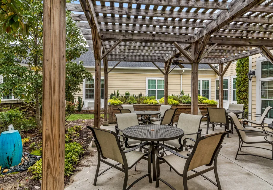 Senior living in Huntersville featuring a pergola over outdoor seating.
