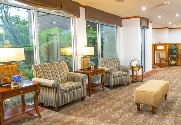 Senior Living in Seattle, WA with armchairs under large windows.