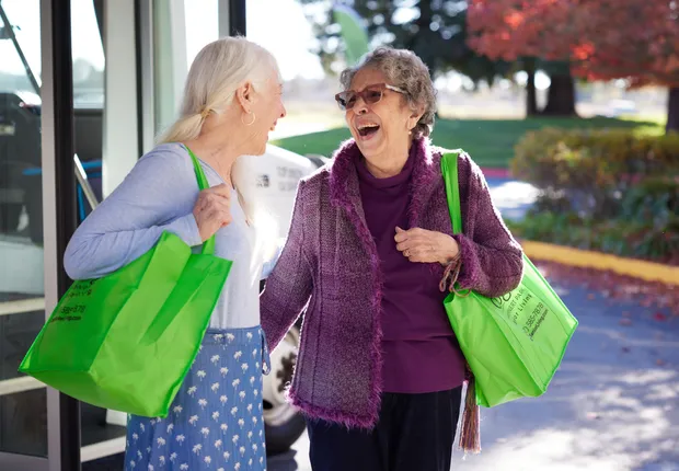 Two senior women having fun shopping.