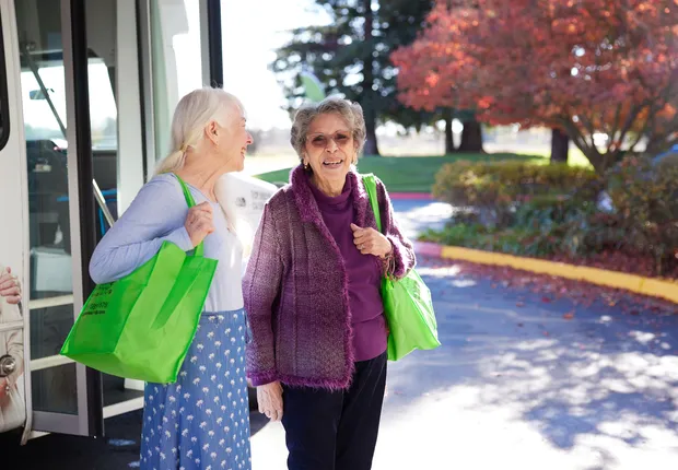 Senior woman take a stroll after a shopping trip.