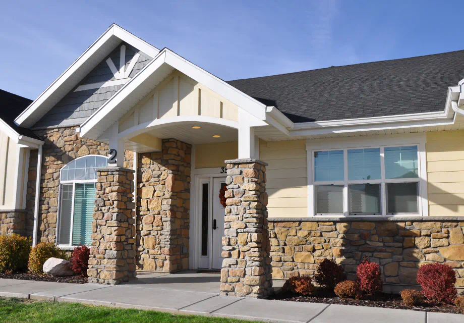 Senior Living in Ogden, UT. A stone exterior with large windows.
