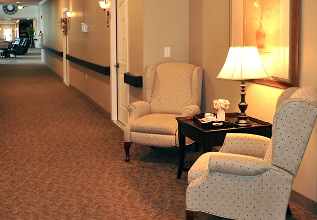 Senior Living in Ogden, UT with ample seating in the halls to socialize.