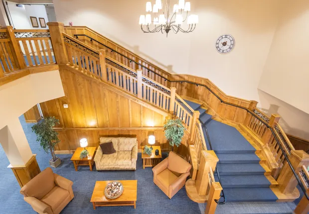 Senior Living in Vancouver, WA with a large curved staircase over the lobby.