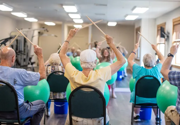 Seniors join in a rhythm class.