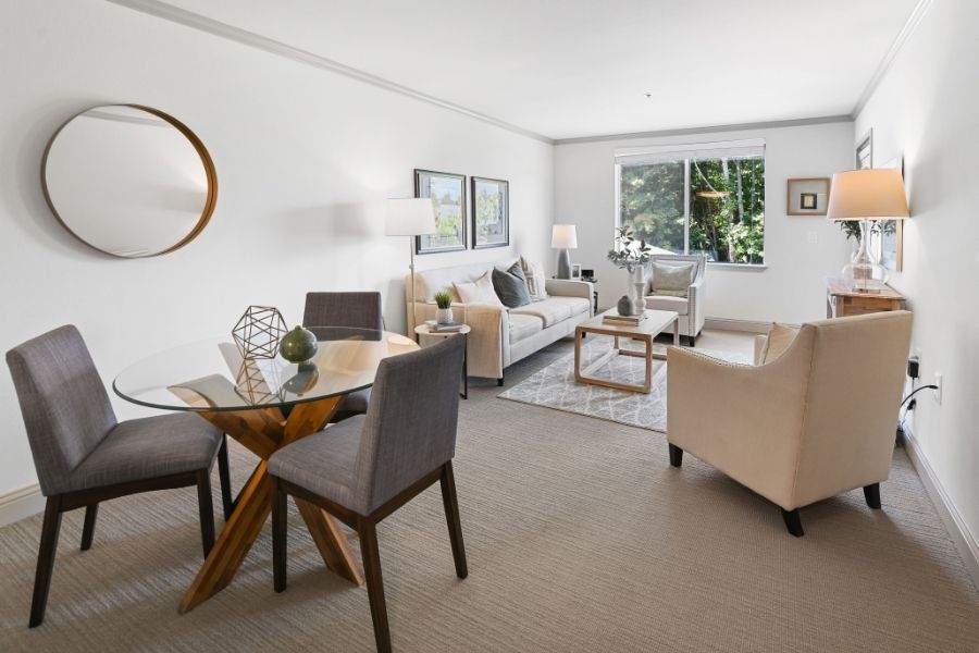 dining table and living room in a model white room