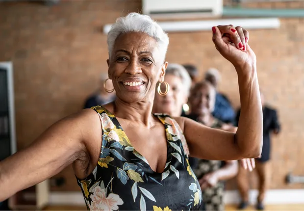 African American senior woman dancing