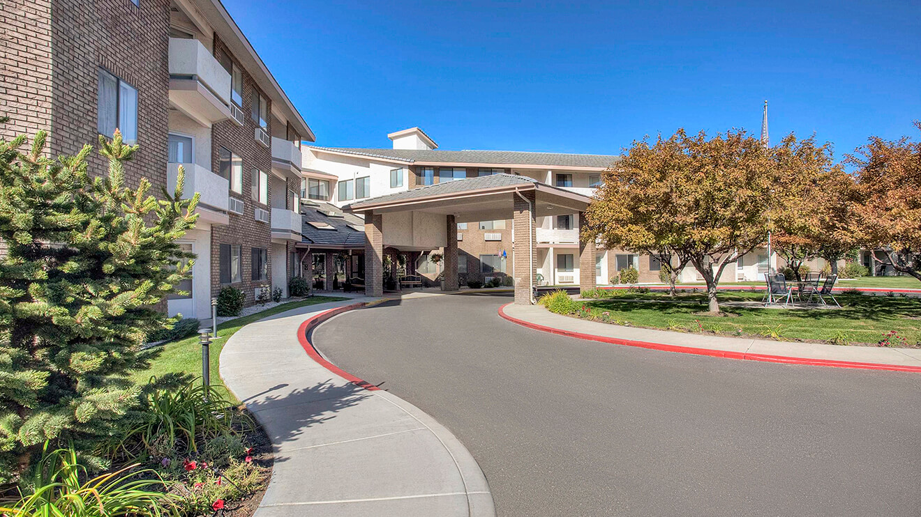 Beautiful outside exterior entrance of Solista Carson in Carson City, NV, featuring modern architecture and beautiful landscaping.