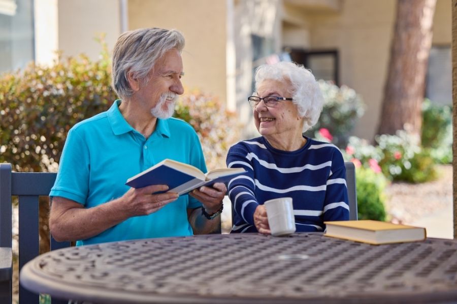 senior couple reading and drinking coffee