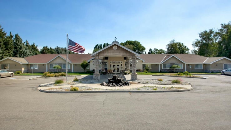 Welcoming entrance surrounded by lush greenery, fostering a sense of community and warmth.