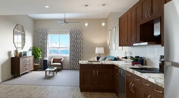 Bright and welcoming, this apartment features a modern kitchen and cozy living space, perfect for community bonding.