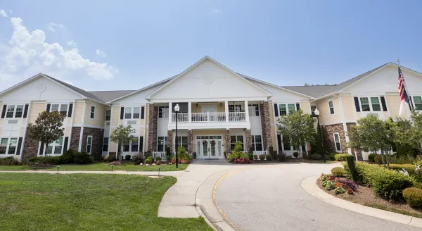 Welcoming residence with lush gardens, inviting pathways, and a bright, sunny atmosphere.