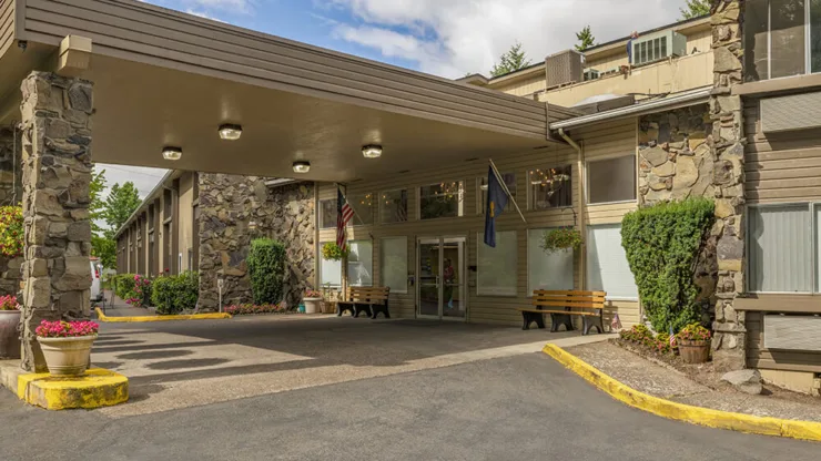 Welcoming entrance with lush plants and cozy seating, inviting a sense of community and warmth.