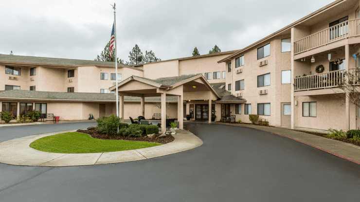 A welcoming entrance surrounded by greenery, inviting residents to enjoy comfort and community.