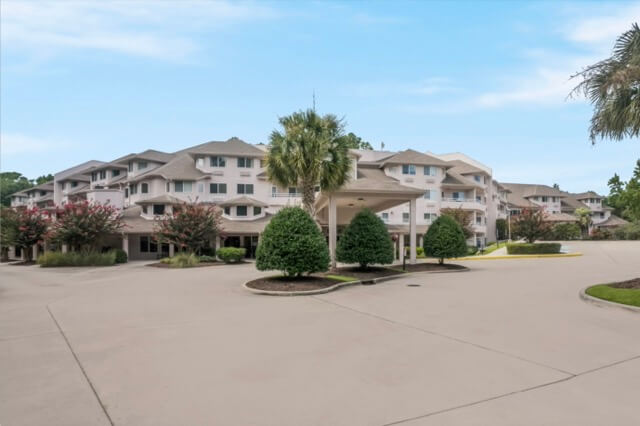 Welcoming community with lush greenery, inviting pathways, and comfortable living spaces.