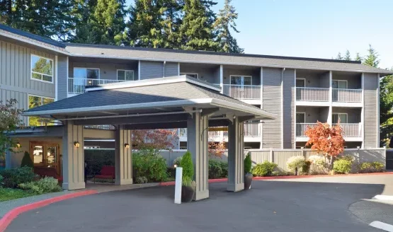 Welcoming entrance surrounded by lush greenery, inviting residents to enjoy a vibrant community.