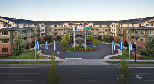 A warm, inviting community with beautifully landscaped grounds and accessible pathways for residents.
