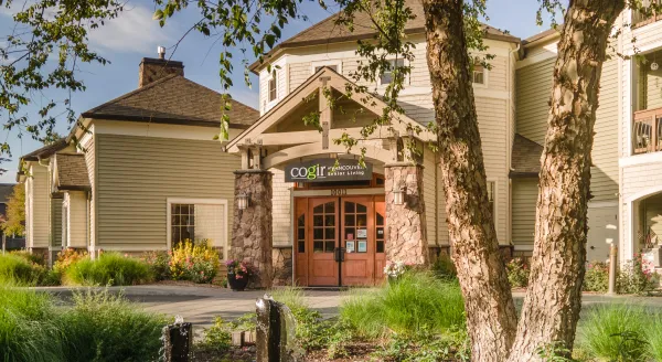 Welcoming entrance surrounded by lush greenery, inviting residents to a vibrant community life.