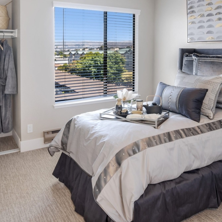 Bright and inviting, this cozy bedroom offers a serene retreat filled with warmth and comfort.