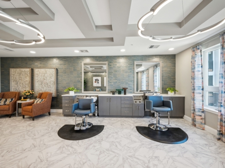 A welcoming salon space designed for relaxation, featuring stylish seating and modern decor.