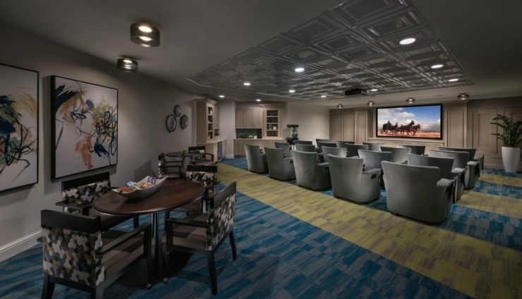 A welcoming activity room featuring comfortable seating and vibrant decor, ideal for community gatherings.