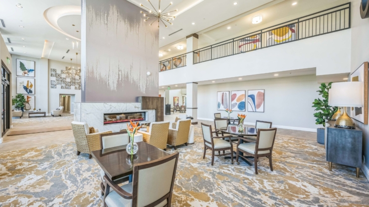 Bright, inviting common area featuring comfortable seating, vibrant decor, and a warm atmosphere for community gatherings.
