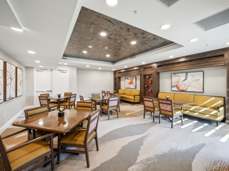 A welcoming lounge with comfortable seating, inviting warmth, and a communal atmosphere for residents.