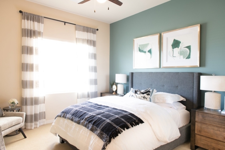 Bright and inviting, this serene bedroom offers comfort with carefully chosen decor and spacious warmth.