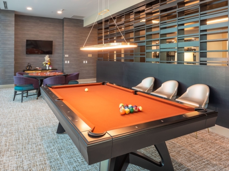 A cozy recreational space inviting residents to enjoy games and foster friendships in a warm atmosphere.