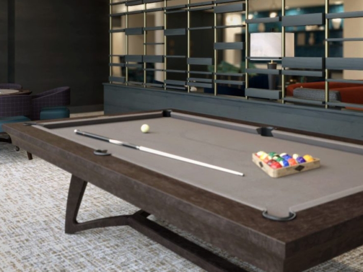 A welcoming recreational space featuring a pool table, cozy seating, and a friendly atmosphere.