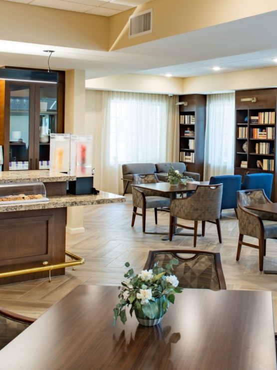 A welcoming space with cozy seating, natural light, and a charming café, perfect for community gatherings.