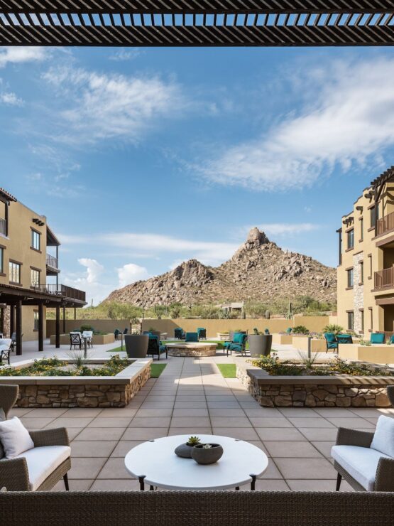 Bright and inviting outdoor space offering stunning mountain views, perfect for community gatherings.