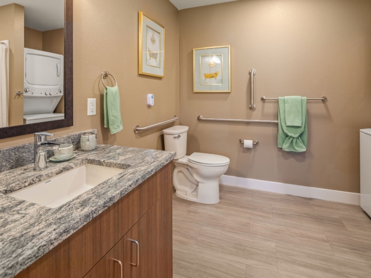 A bright, welcoming bathroom featuring modern amenities, ensuring comfort and accessibility for all residents.