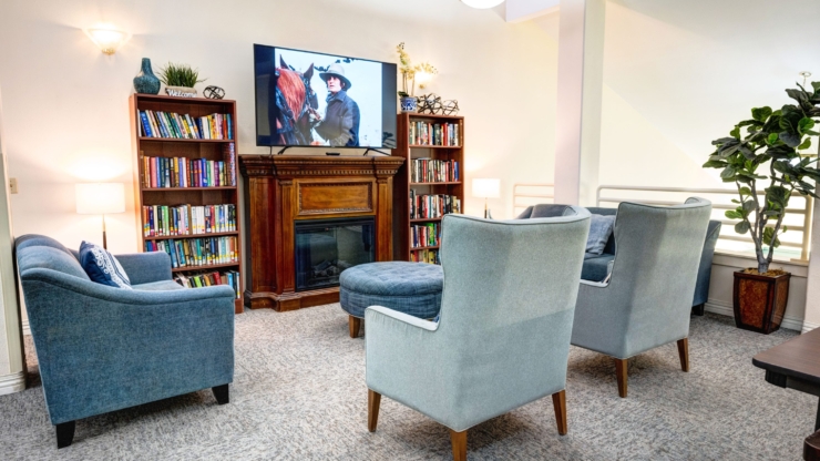 Cozy seating invites connection, with bookshelves and a warm atmosphere perfect for community gatherings.