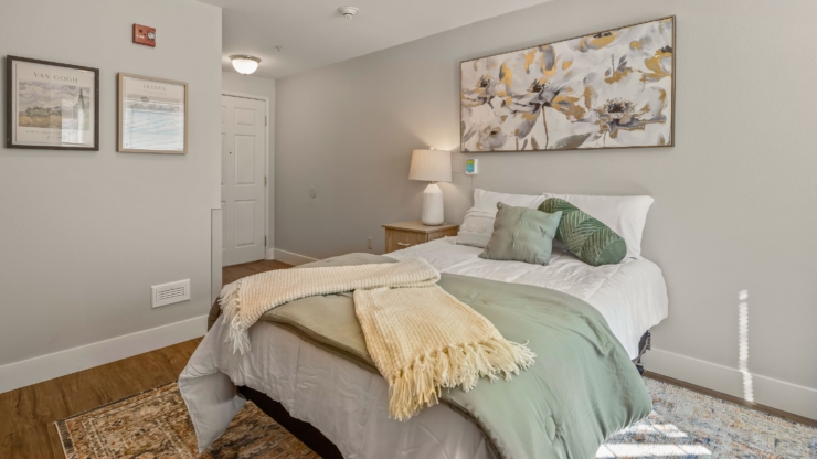 Cozy, inviting room with soft decor, fostering a warm and welcoming atmosphere for residents.