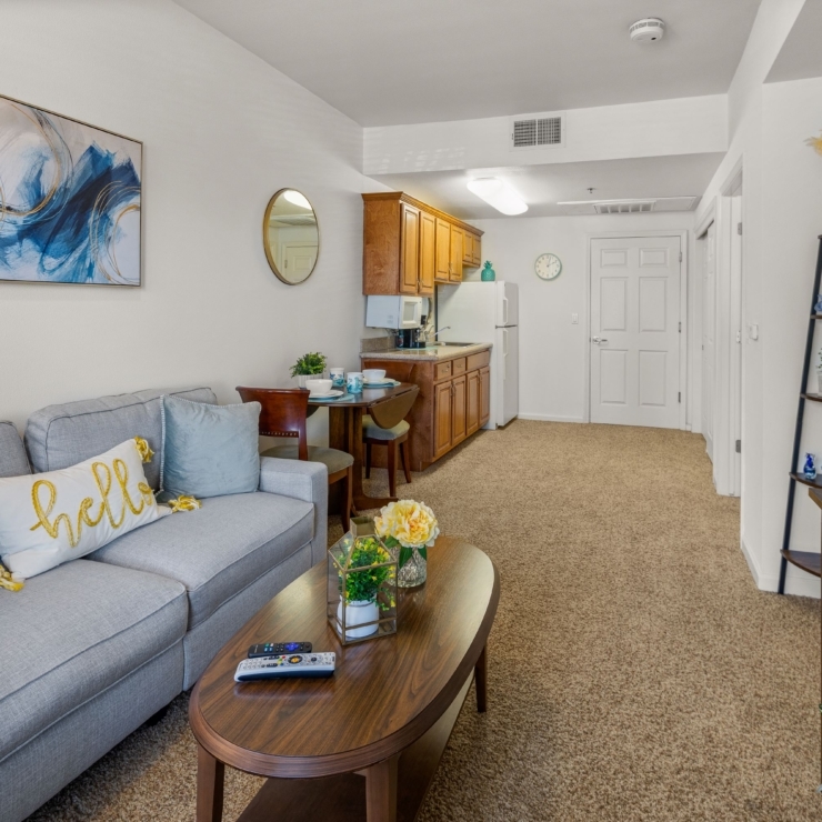 A welcoming living space featuring comfortable seating, warm decor, and a sense of community.