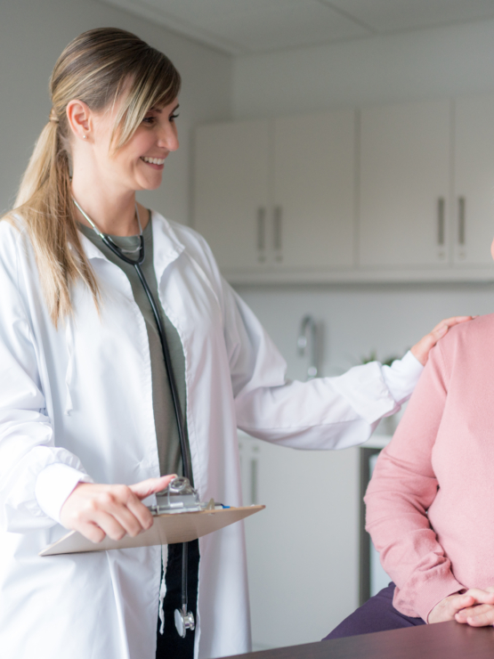 A warm interaction between a caregiver and resident, showcasing genuine care and community spirit.