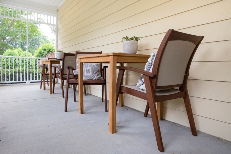 Inviting outdoor seating encourages community connections and relaxation in a warm, welcoming setting.